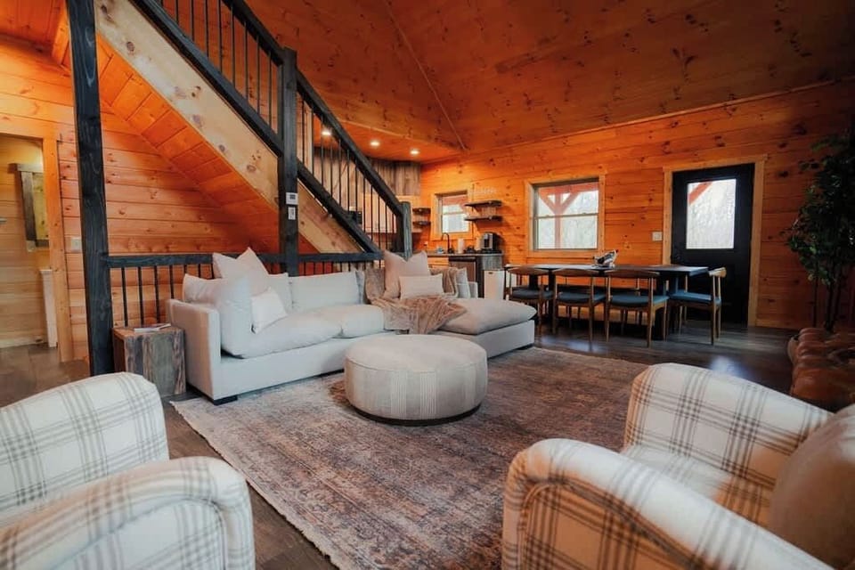 Living Room: Light pours in through windows, illuminating stylish furniture and a spacious dining area!