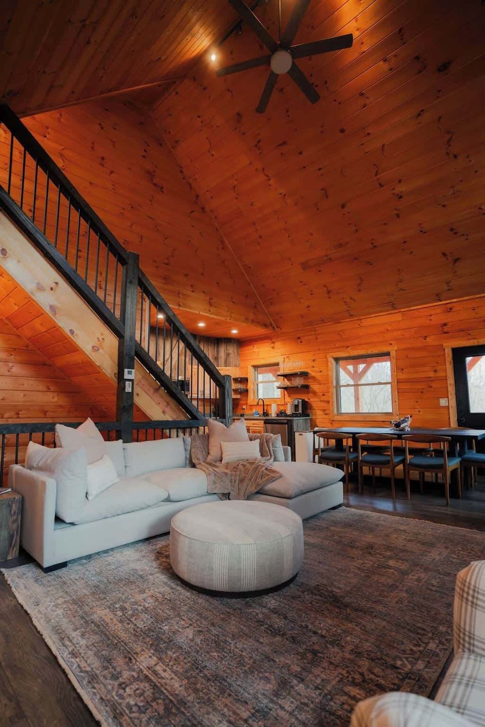 Living Room: Cathedral ceilings and warm wood tones invite you to unwind and entertain!