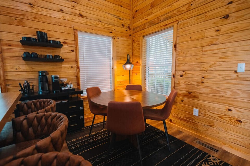 The dining area has seating for four near the kitchen so everyone can gather and eat in the same space.
