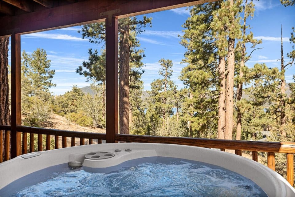 Surrender to nature`s embrace and find serenity as you relax and rejuvenate in the hot tub.
