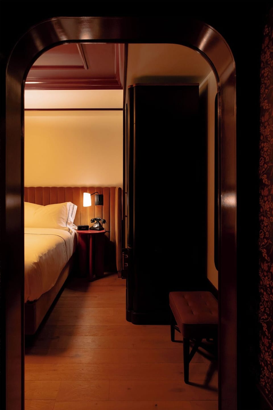 Step into a cozy retreat framed by rich, dramatic details.