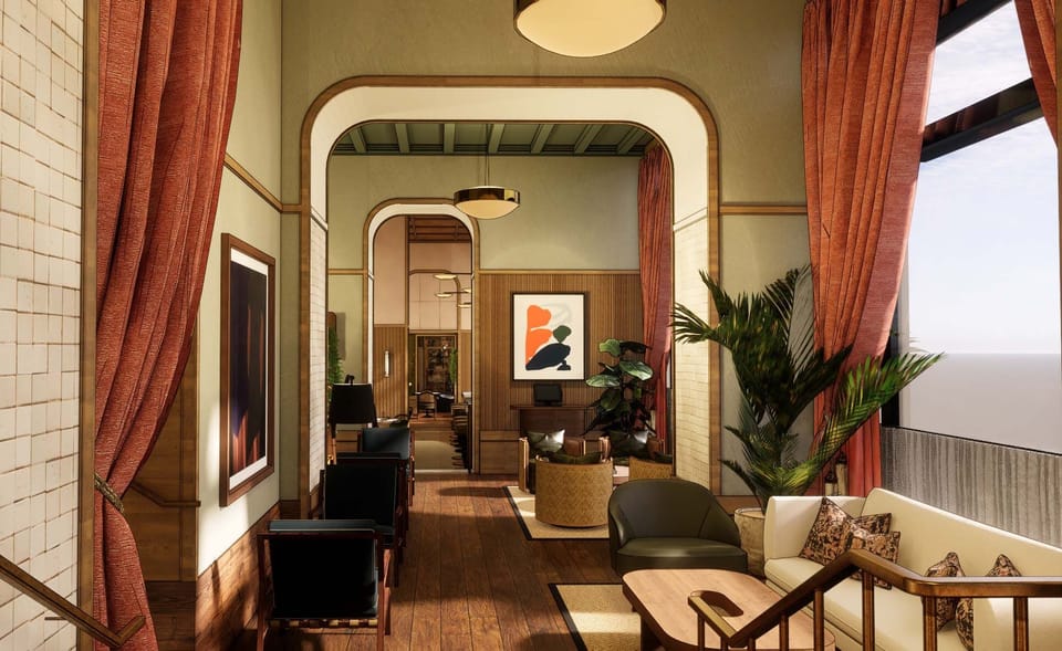 Unwind in the sunlit lounge, framed by rich drapes.