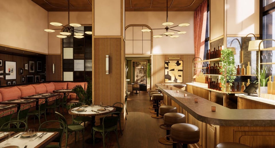 Sip craft cocktails at the glowing bar, surrounded by warmth.