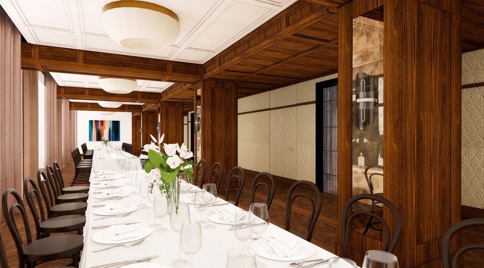 Gather for elegant long-table dinners in a wood-paneled setting.