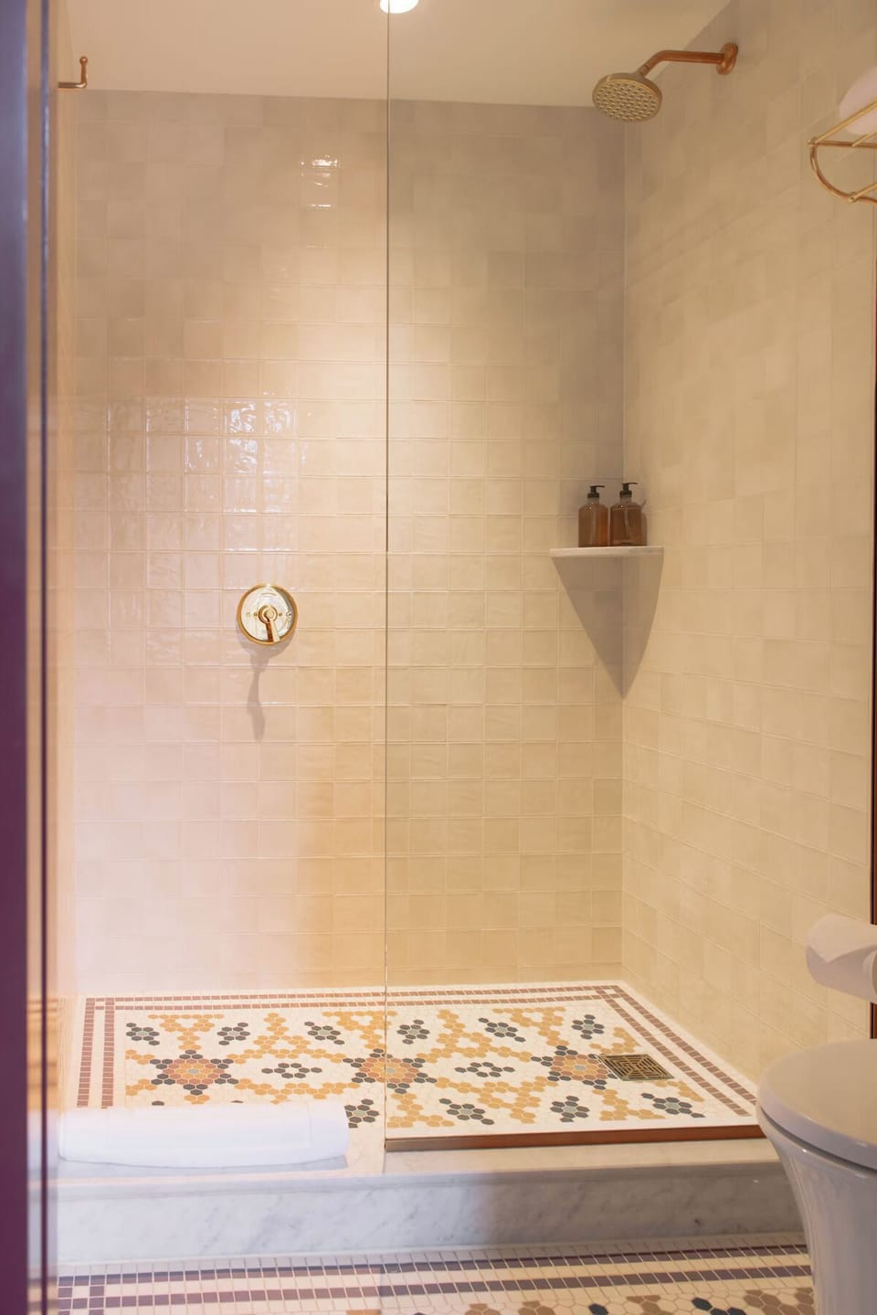 Rinse off under a spacious walk-in shower with rainfall head.