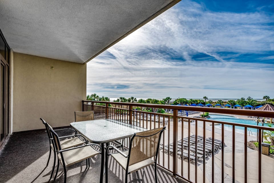 The private balcony is the perfect place to relax after a long day at the beach.
