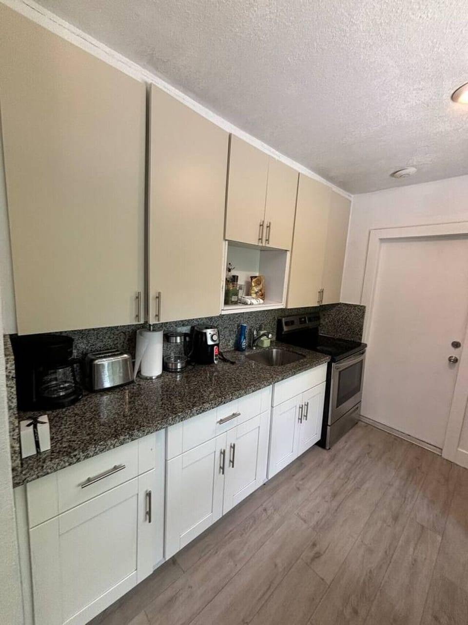 A well-equipped kitchenette stocked with plenty of cutlery and a selection of coffee for your convenience
