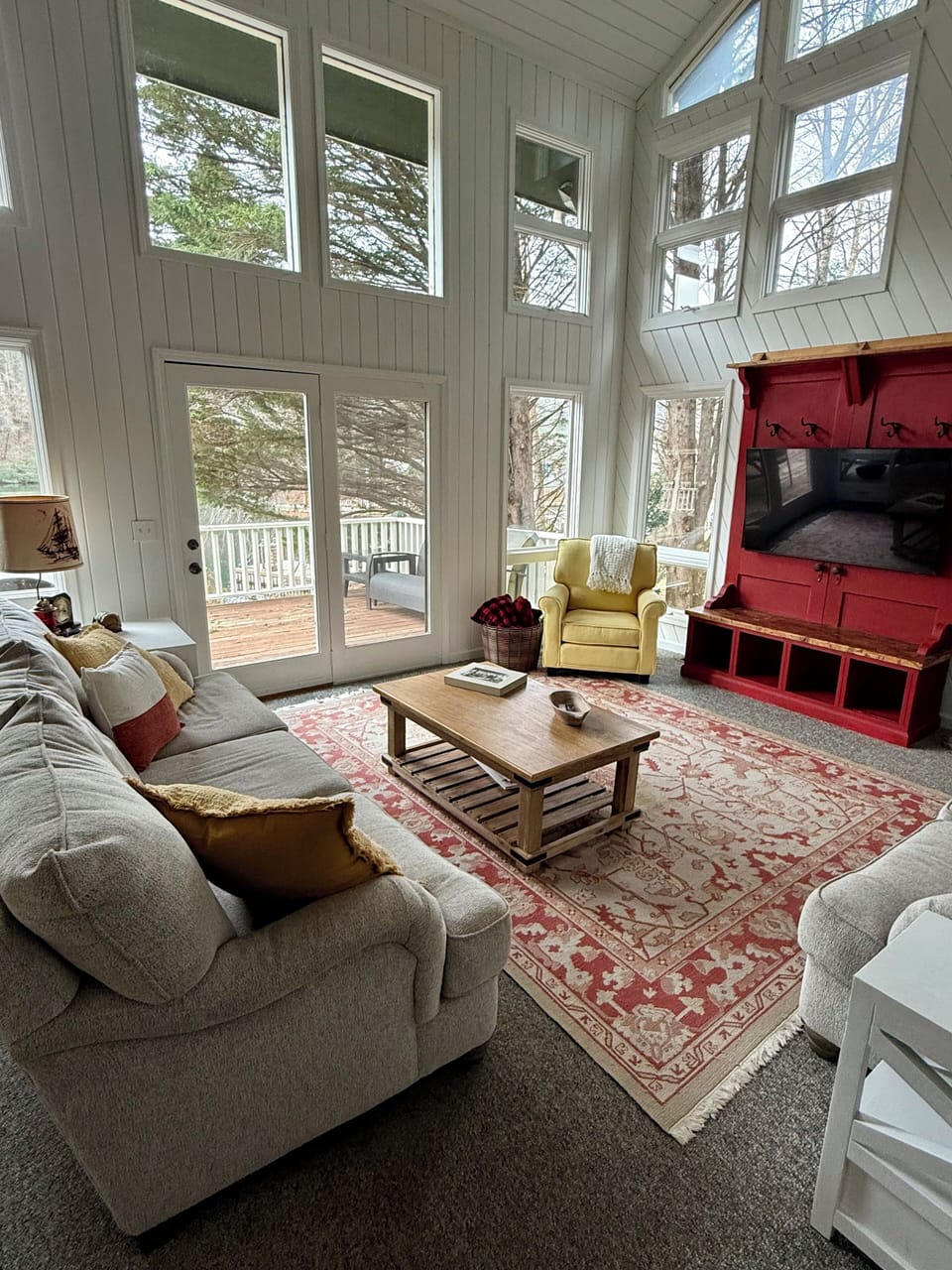 Living area = amazing views of the lake + easy access to porch and boathouse.
