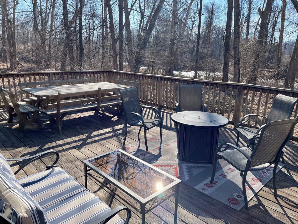 Outdoor gathering and dining with creek view. 