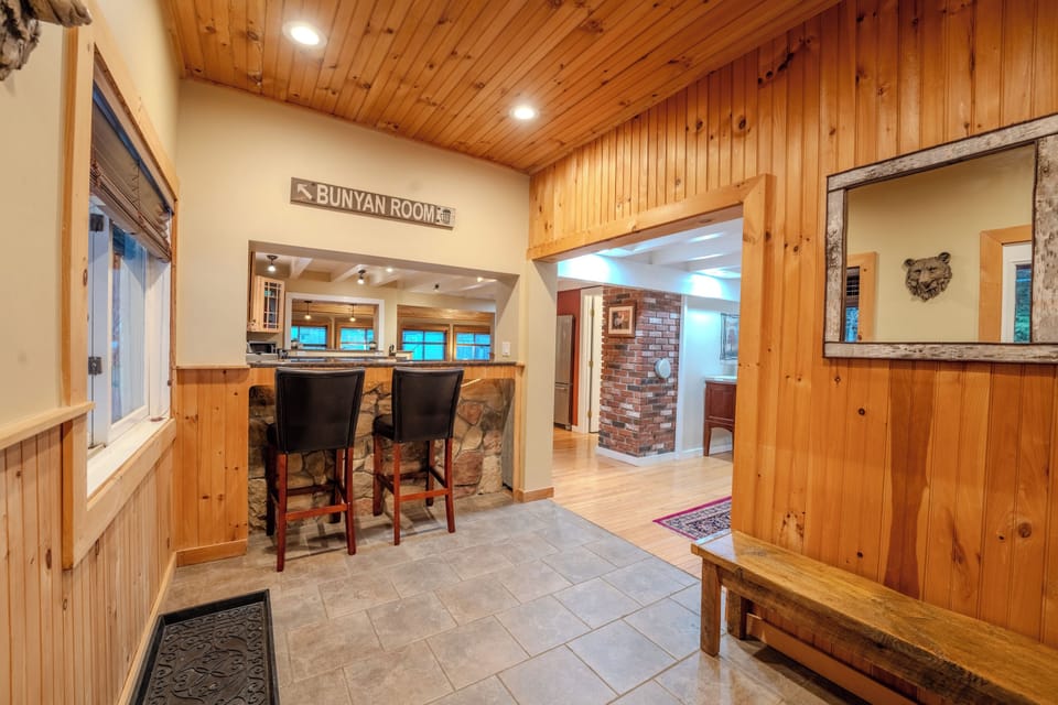 The grand entrance complete with bar seating overlooking the kitchen. 