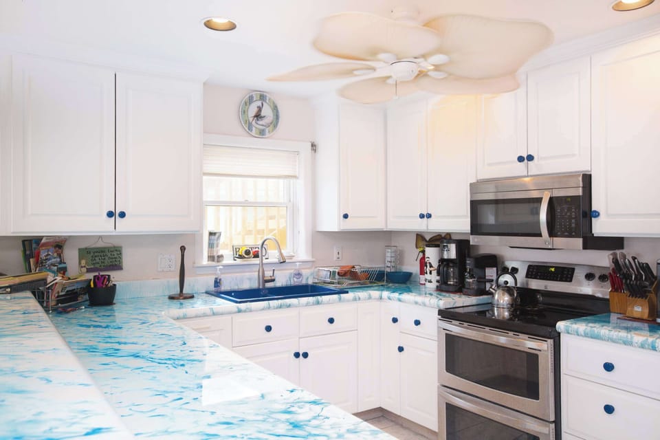 Kitchen with stainless steel appliances. 