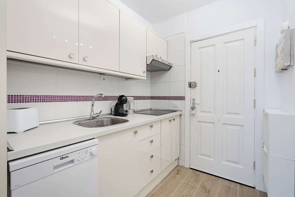 Kitchen with Coffee Maker, Toaster, Electric Kettle, Microwave, Oven, Stovetop, Dishwasher and Fridge
