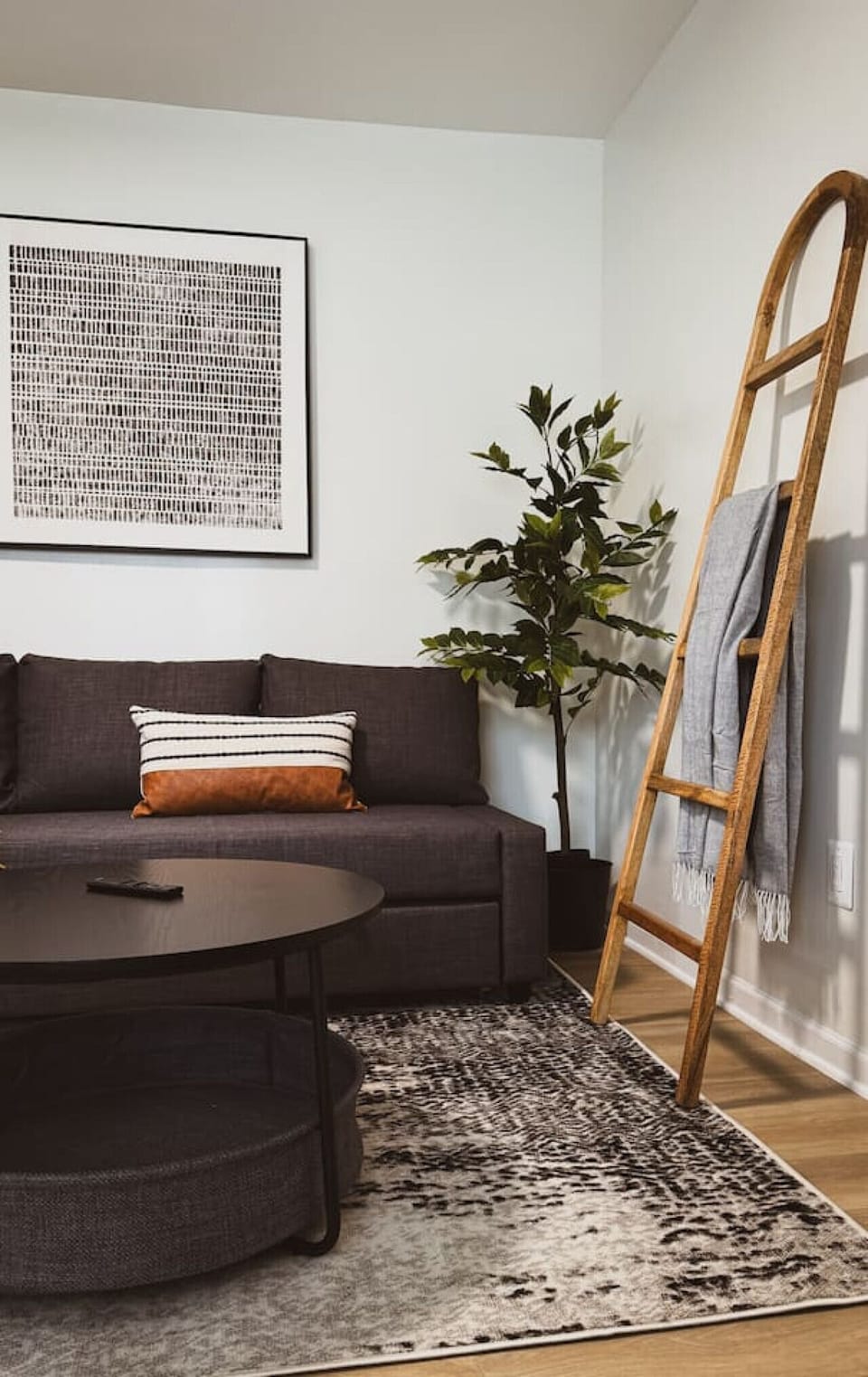 You feel a sense of peace as you step into the living room , with its inviting decor and soothing tones.