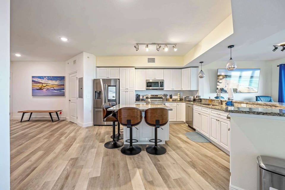 Modern kitchen with granite countertops and stainless steel appliances