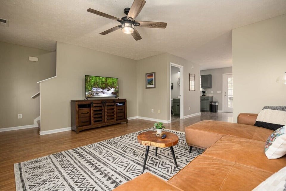 Kick back in style with modern decor and a view of nature on the big screen!