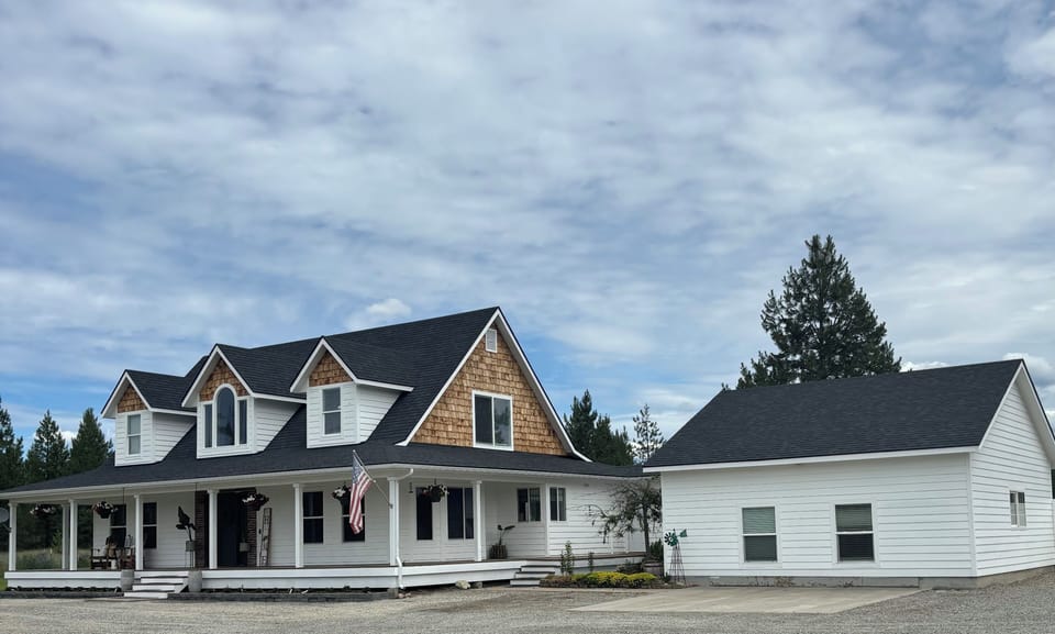 Front of house, main house to the left, game room to the right.