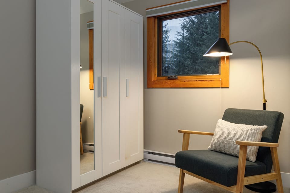 Bedroom 2 - Queen bed with reading chair and closet for storage.