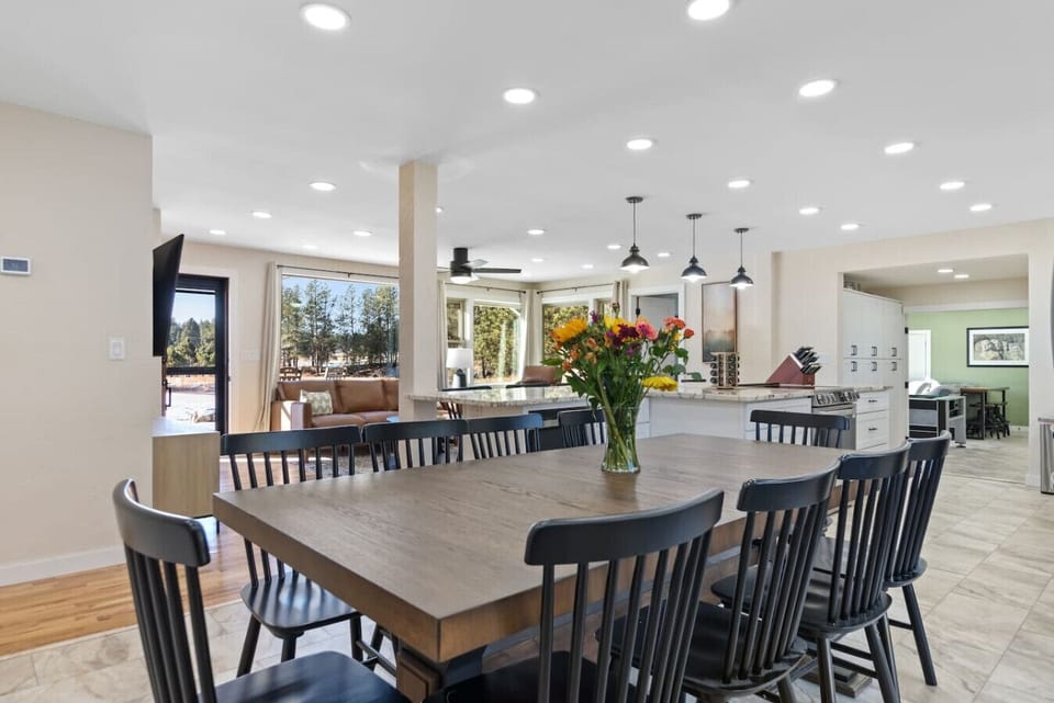 Gather around the large dining table, perfect for family meals and creating lasting memories.