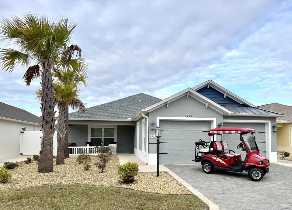 House Front with 4-Seater Golf Cart for Guest Use!