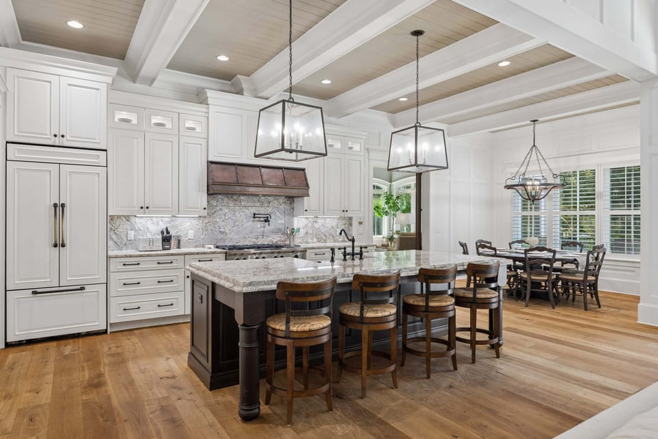 The chef's kitchen boasts high-end appliances, including a gas range and pot filler, perfect for cooking family meals or entertaining.