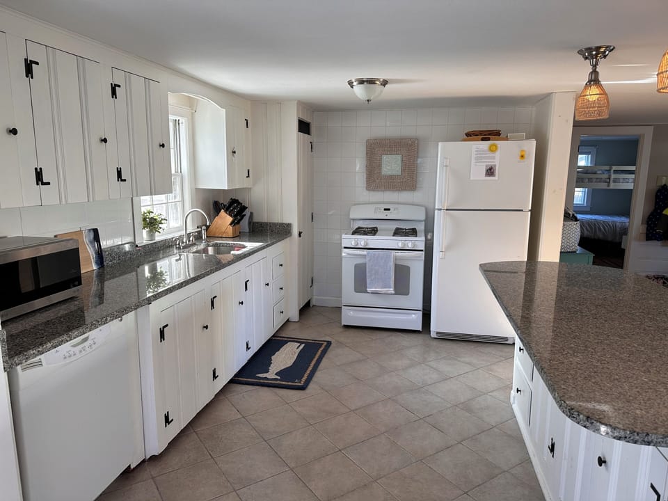 Kitchen between two great living spaces