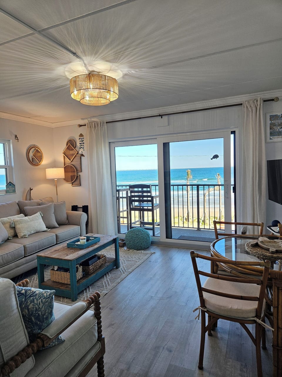 New sliding glass doors with turtle tint leading to double ocean front balcony