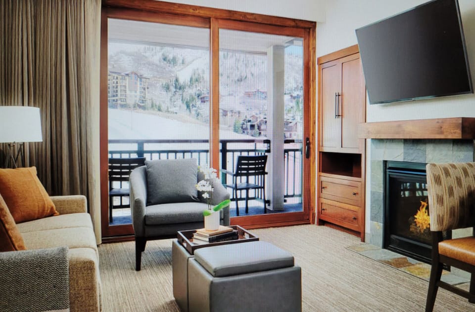 Living room area with TV/Fireplace/Private Patio