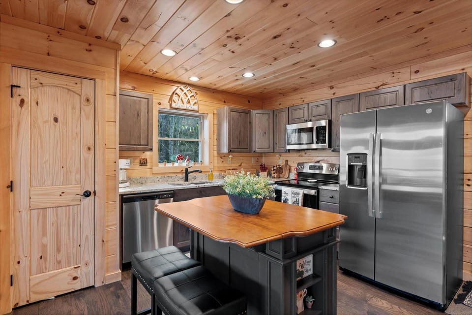 Cozy kitchen with island for extra counter space.