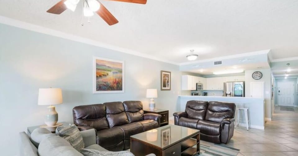 The living room is equipped with sleeper sofa, love seat, and chair.