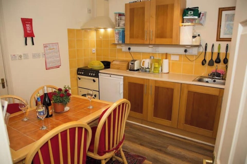 Kitchen. Large fridge/freezer (behind the door). Washer/Dryer in utility room.