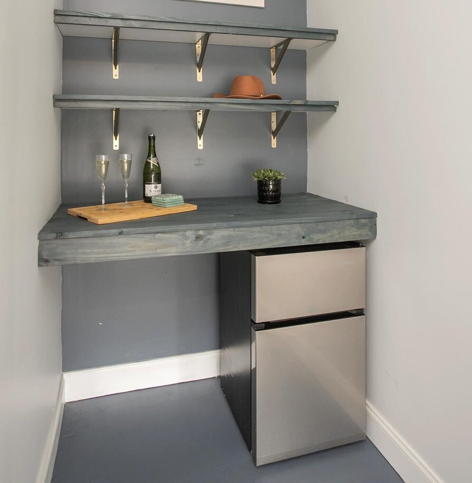 Convenient mini bar in the game room equipped with a mini fridge for drinks