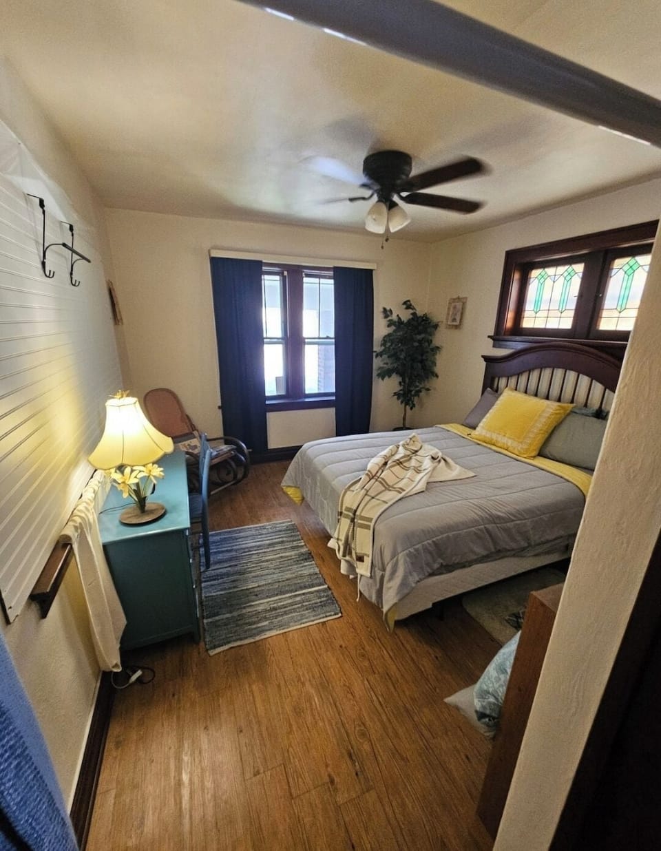 Large bedroom suite nxt to bth with desk, rocking chair and room for child space