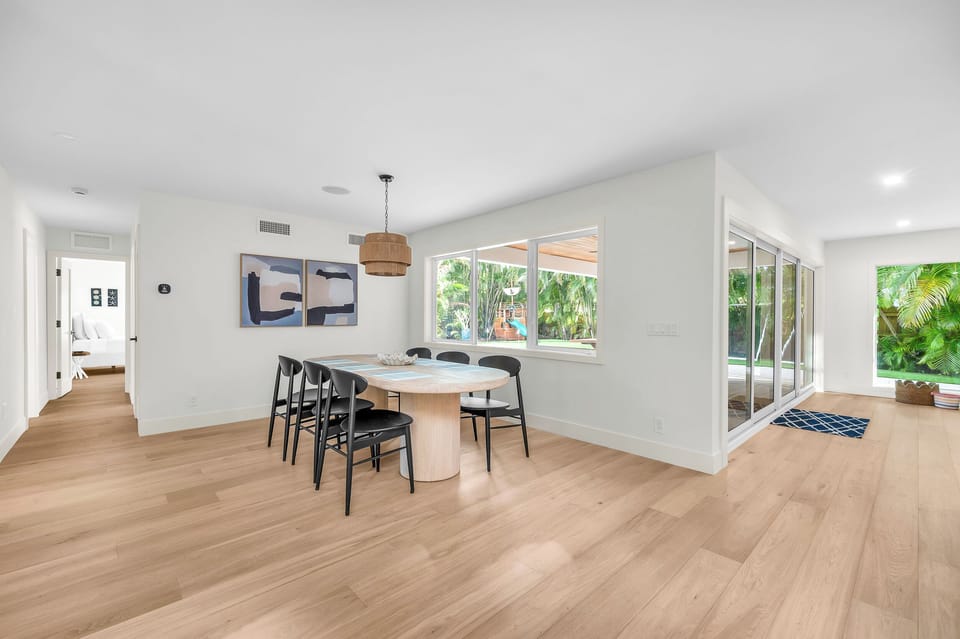 Dining room seats six with pool and garden view