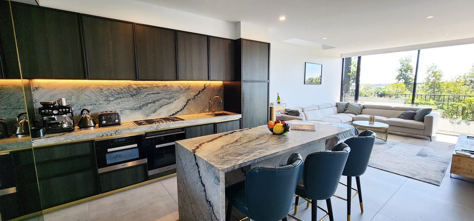 Barista style coffee machine, large marble kitchen island. Well equipped.