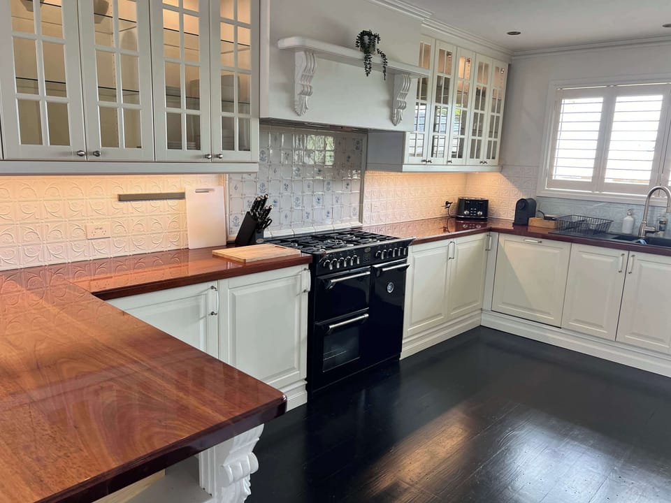 Fully-equipped kitchen with ample kitchenware and white goods