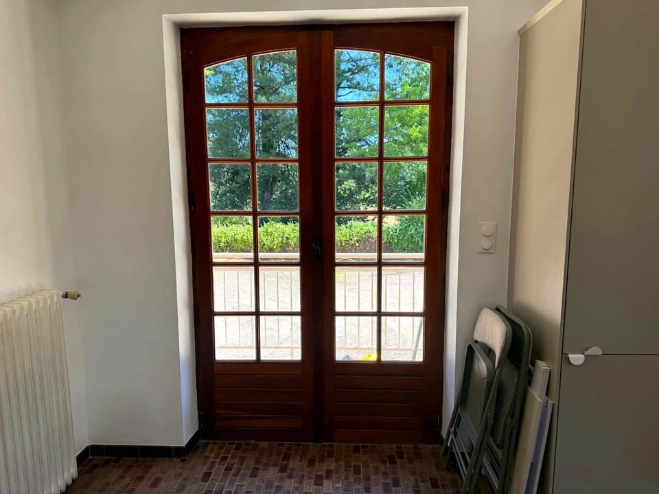 French doors opening onto private garden views