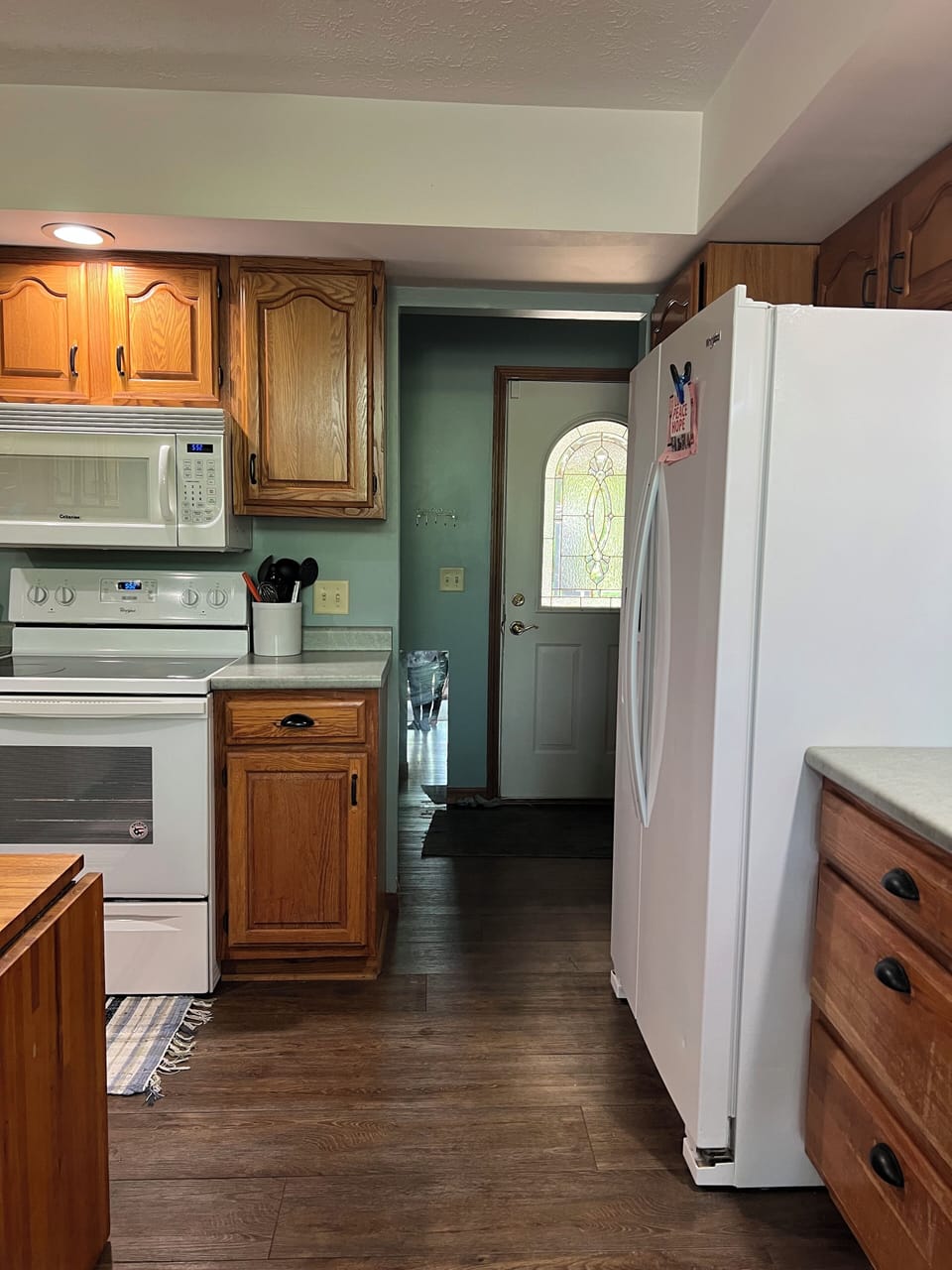 Looking from the dining room side of the kitchen to the entry hall
