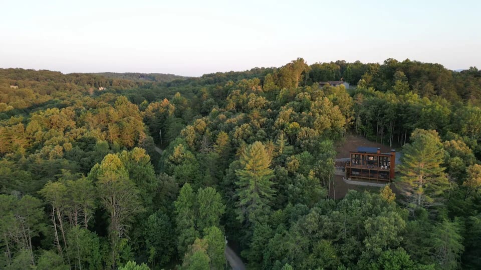 This aerial view captures the peaceful setting, the long private drive, and the feeling of arriving at your own winter hideaway.