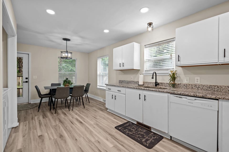Kitchen with appliances and basic essentials.