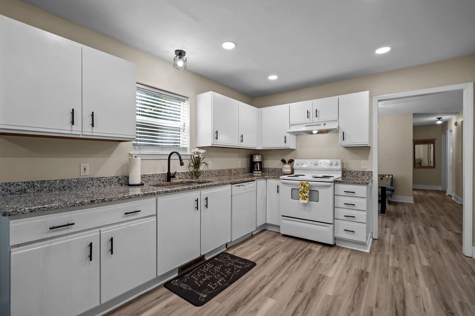 Kitchen leading back to game room and two other beds and bath.