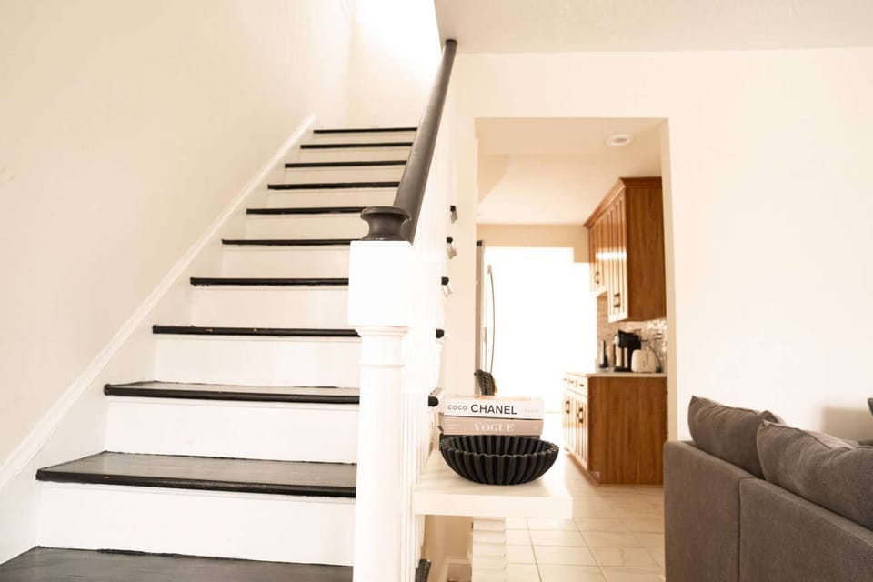 Stylish staircase connecting the main living areas and the bedroom