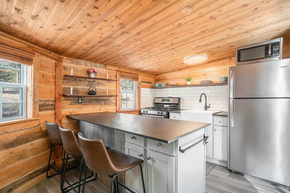 Kitchen area with seating for three.