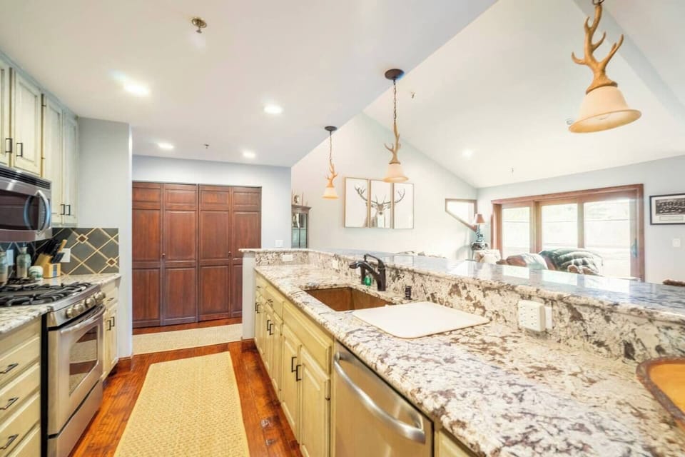 The large fully equipped kitchen has luxurious fixtures, granite countertops and tons of storage.  You only will need to bring the food!