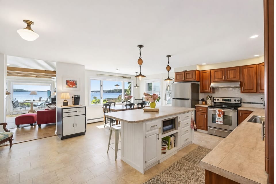 Here is the open kitchen/ dining/ living area with beautiful ocean views.