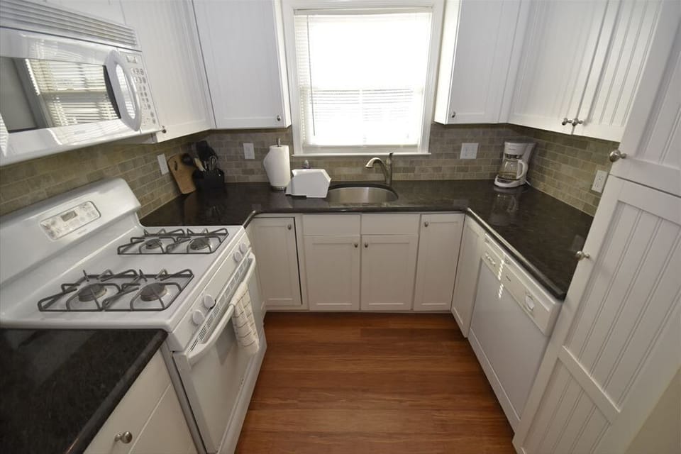 Fully equipped kitchen with modern appliances, ample counter space, and everything you need to prepare delicious meals.