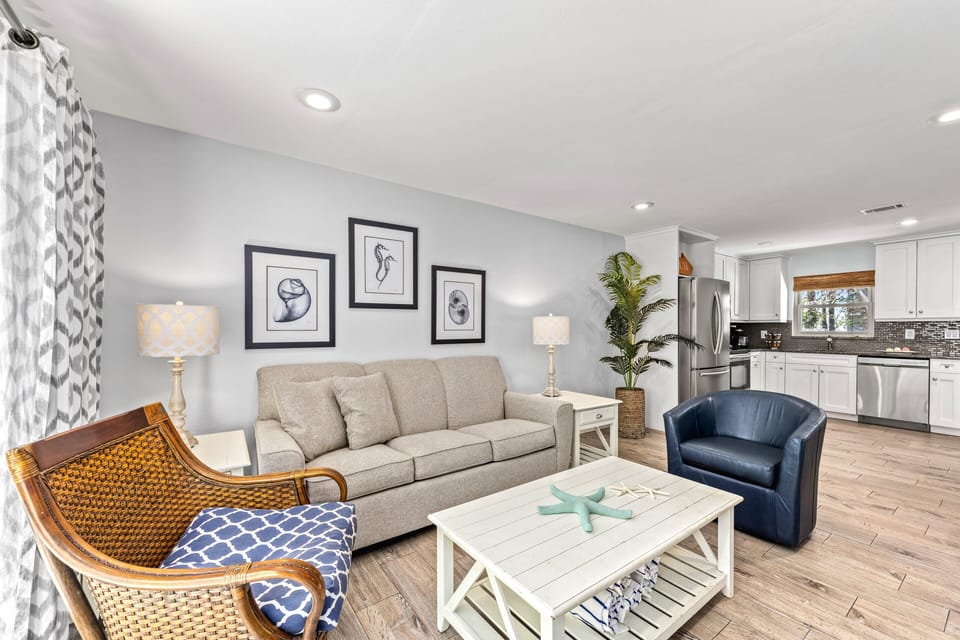 Living Area showing seating.  Kitchen shown in background