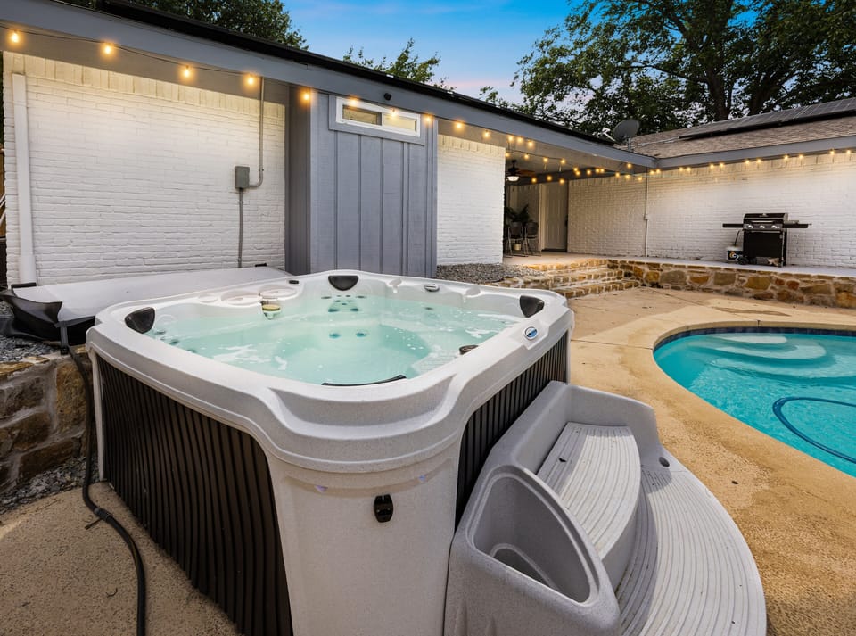 Unwind in the hot tub right next to the pool - perfect spot to relax!