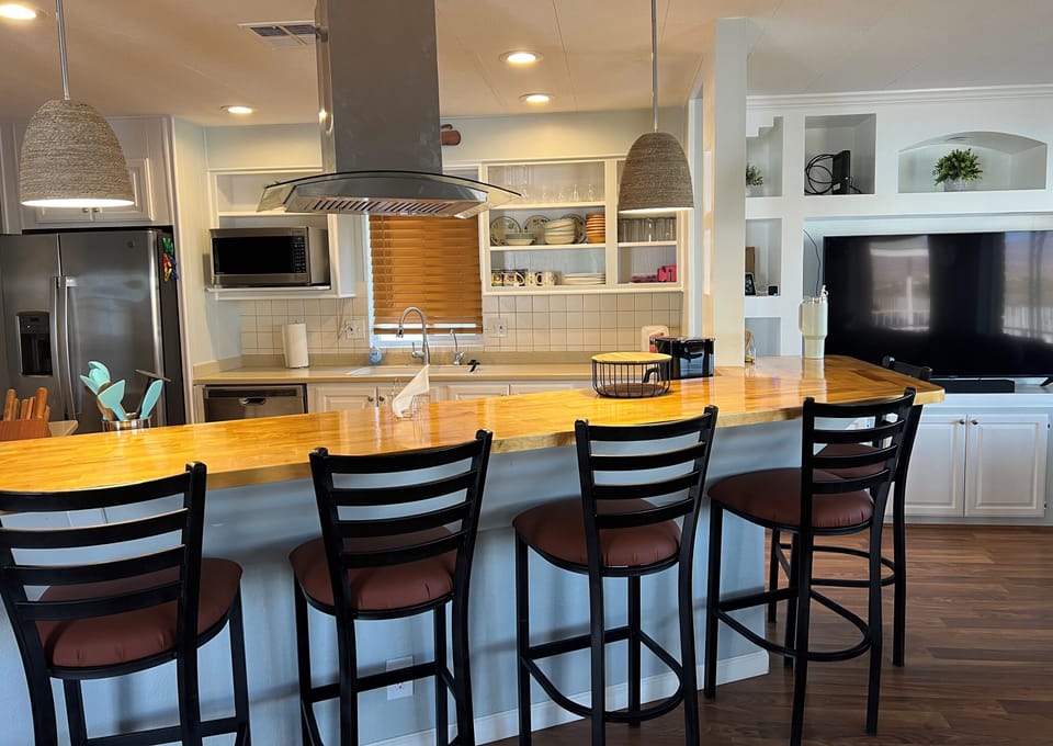 Large bar top eating area with 55' Smart TV.