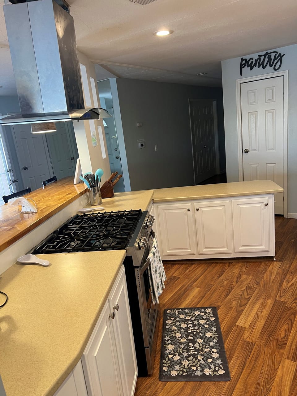 Fully stocked kitchen with 5 burner stove, oven, microwave, washer and dryer.