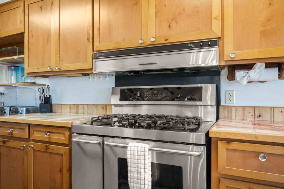 The kitchen is spacious and efficient. A perfect place to prepare a family meal.